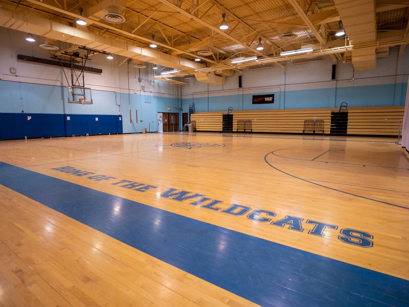 Tonalea Day School Home of the Wildcats gymnasium with basketball nets.