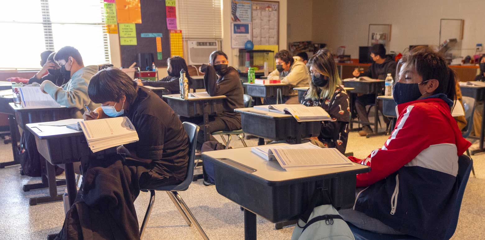 Full classroom of students working on an assignment.